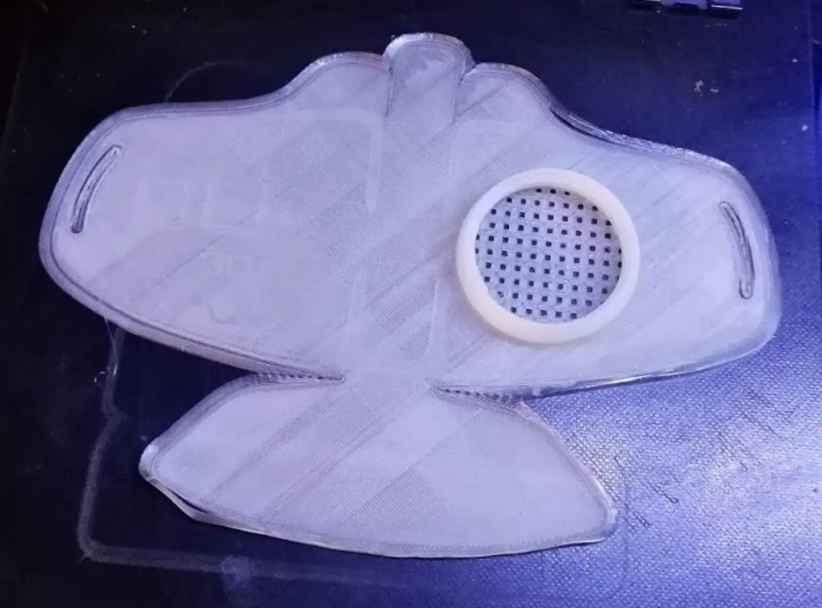 Copper3D mask on printer bed, in white PLA.