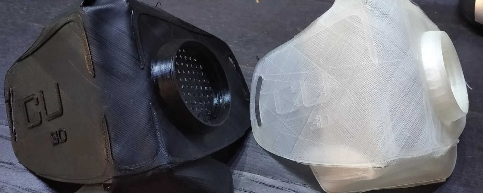 Copper3D masks, molded. Printed from black PET-G (left), and white PLA (right).