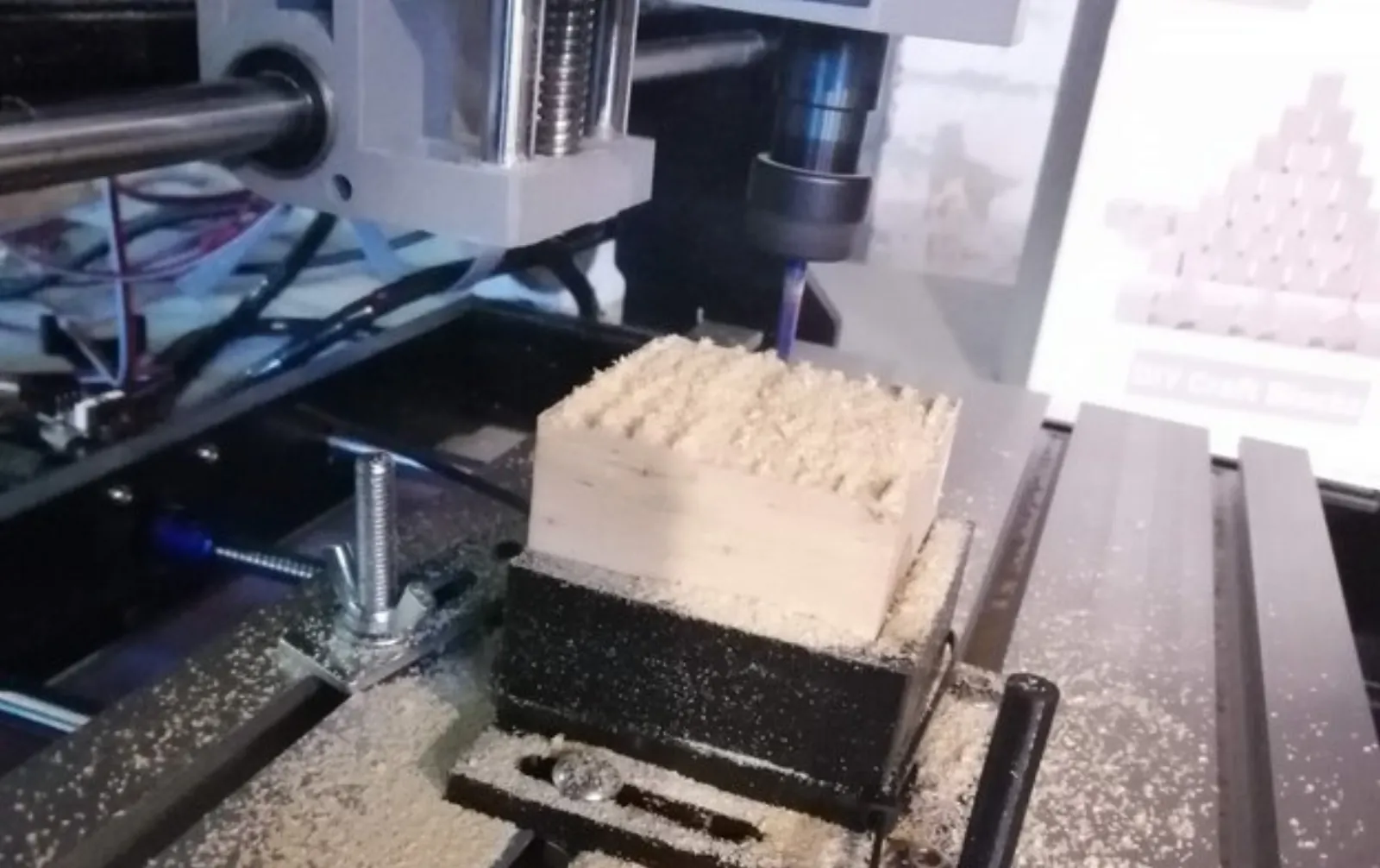 Small 3018 CNC router, cutting pine using 3d-printed softjaws.