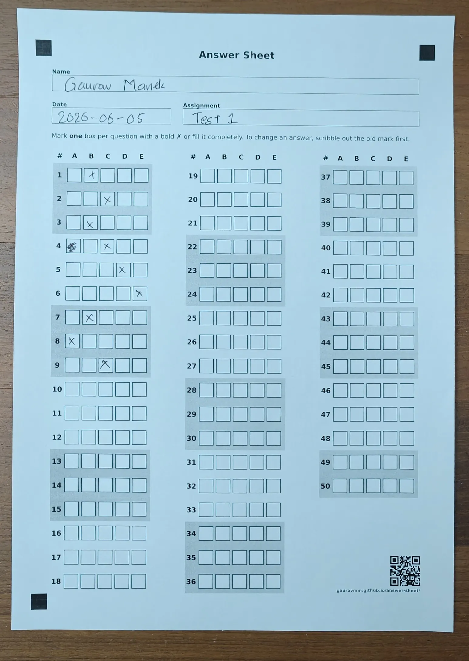 A completed answer sheet, photographed on a phone. [Download it](demo-sheet.webp) and feed it to the app.