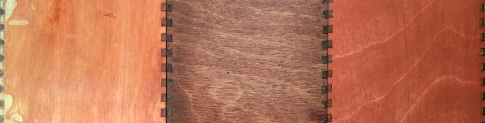 From left to right: MinWax crimson water-based stain with boiled linseed oil, MinWax Gel Mahogany stain, and MinWax crimson water-based stain (double)